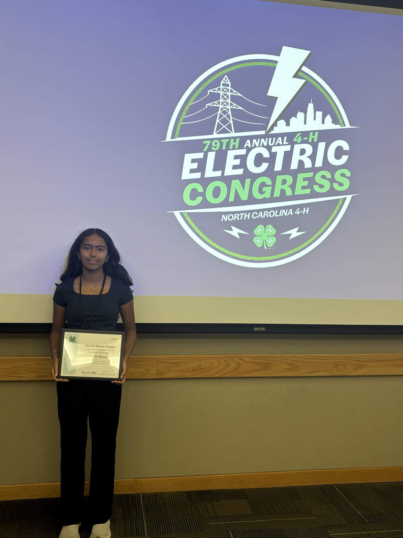 79th Electric Congress - Hasini with Electric Congress certificate.