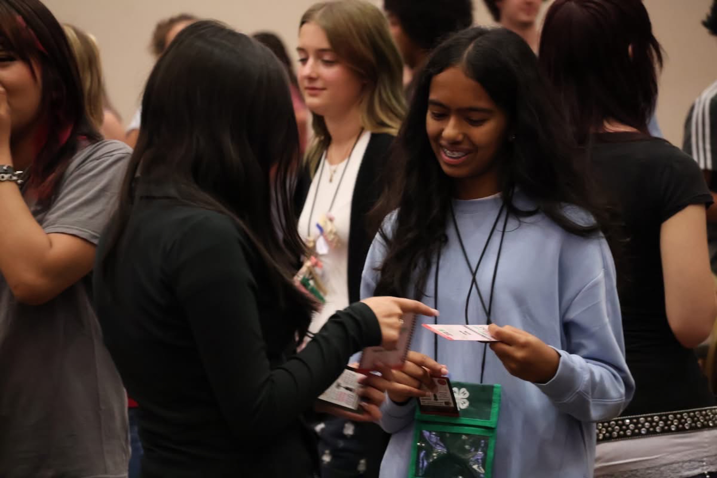 Delegates trading clothespins during the pin exchange.